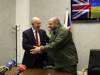 John Healey, Secretary of State for the Defence of the UK, and Rustem Umerov, Minister of Defence of Ukraine, are shaking hands before a joi...