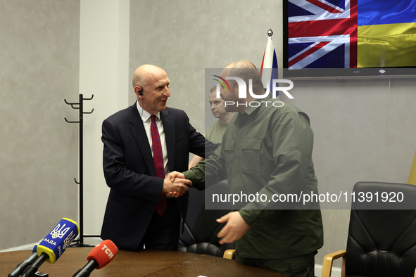 John Healey, Secretary of State for the Defence of the UK, and Rustem Umerov, Minister of Defence of Ukraine, are shaking hands before a joi...