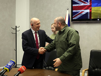 John Healey, Secretary of State for the Defence of the UK, and Rustem Umerov, Minister of Defence of Ukraine, are shaking hands before a joi...