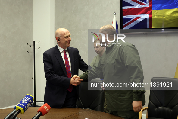 John Healey, Secretary of State for the Defence of the UK, and Rustem Umerov, Minister of Defence of Ukraine, are shaking hands before a joi...