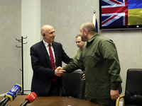 John Healey, Secretary of State for the Defence of the UK, and Rustem Umerov, Minister of Defence of Ukraine, are shaking hands before a joi...