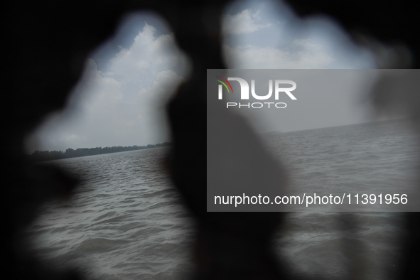 Flood water is moving south from north through the Brahmaputra River in Kurigram, Bangladesh, on July 8, 2024. 