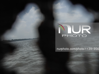 Flood water is moving south from north through the Brahmaputra River in Kurigram, Bangladesh, on July 8, 2024. (