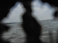 Flood water is moving south from north through the Brahmaputra River in Kurigram, Bangladesh, on July 8, 2024. (