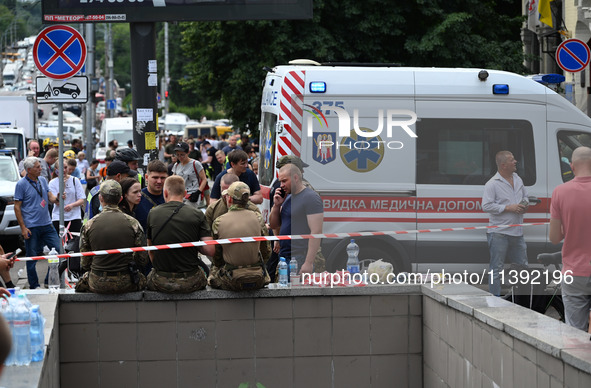 Ukrainian rescuers of emergency services and police officers are working at the site of Okhmatdyt children's hospital damaged by Russian mis...