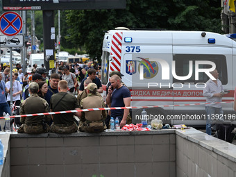 Ukrainian rescuers of emergency services and police officers are working at the site of Okhmatdyt children's hospital damaged by Russian mis...