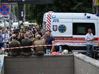 Ukrainian rescuers of emergency services and police officers are working at the site of Okhmatdyt children's hospital damaged by Russian mis...