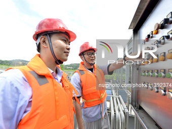 Workers are inspecting water supply equipment in Chaohu, China, on July 8, 2024. (