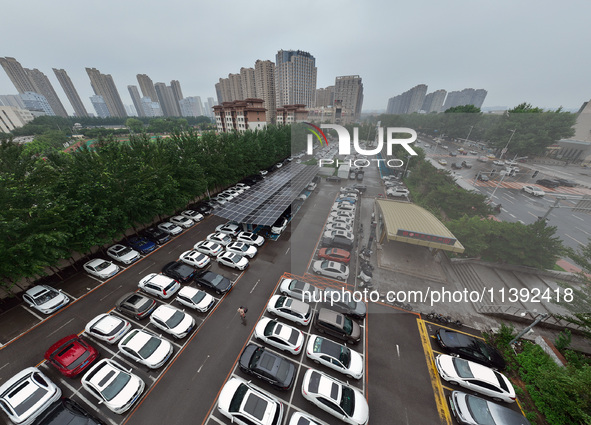 Charging stations are filling with charging vehicles in Shenyang, China, on July 8, 2024. It is understood that the charging station is sett...