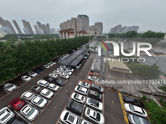 Charging stations are filling with charging vehicles in Shenyang, China, on July 8, 2024. It is understood that the charging station is sett...