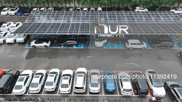 Charging stations are filling with charging vehicles in Shenyang, China, on July 8, 2024. It is understood that the charging station is sett...