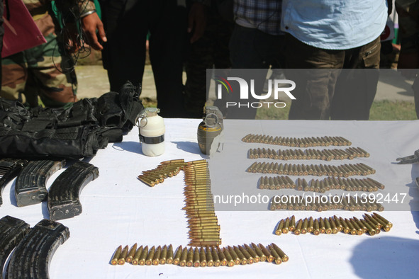 Arms and ammunition are being recovered from militants in twin encounters and are being displayed at an army base in Anantnag, south of Srin...