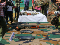 Arms and ammunition are being recovered from militants in twin encounters and are being displayed at an army base in Anantnag, south of Srin...