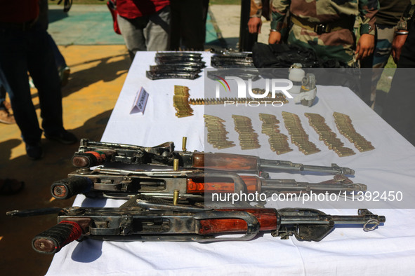 Arms and ammunition are being recovered from militants in twin encounters and are being displayed at an army base in Anantnag, south of Srin...