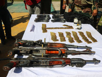 Arms and ammunition are being recovered from militants in twin encounters and are being displayed at an army base in Anantnag, south of Srin...