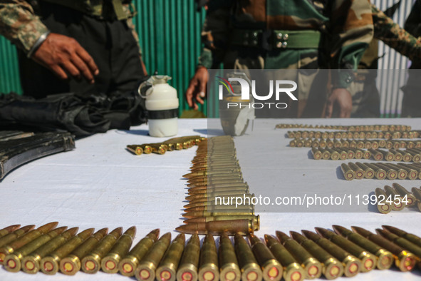 Arms and ammunition are being recovered from militants in twin encounters and are being displayed at an army base in Anantnag, south of Srin...