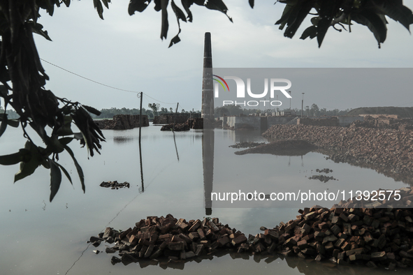 A brick field is being submerged with flood water, flowing from the Brahmaputra River in Jamalpur, Bangladesh, on July 8, 2024. 