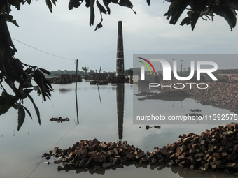 A brick field is being submerged with flood water, flowing from the Brahmaputra River in Jamalpur, Bangladesh, on July 8, 2024. (