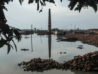 A brick field is being submerged with flood water, flowing from the Brahmaputra River in Jamalpur, Bangladesh, on July 8, 2024. (