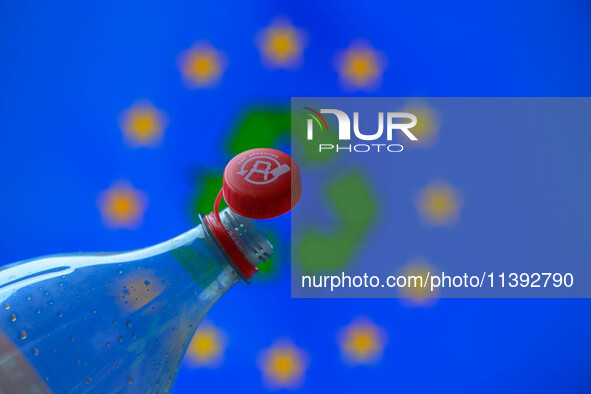 A plastic soda bottle with an attached cap (tethered cap) is being shown as per new EU regulations in Brussels, Belgium, on July 8, 2024. 