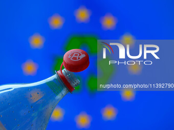 A plastic soda bottle with an attached cap (tethered cap) is being shown as per new EU regulations in Brussels, Belgium, on July 8, 2024. (