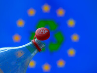 A plastic soda bottle with an attached cap (tethered cap) is being shown as per new EU regulations in Brussels, Belgium, on July 8, 2024. (