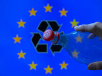 A plastic soda bottle with an attached cap (tethered cap) is being shown as per new EU regulations in Brussels, Belgium, on July 8, 2024. (