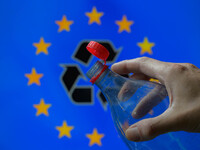 A plastic soda bottle with an attached cap (tethered cap) is being shown as per new EU regulations in Brussels, Belgium, on July 8, 2024. (