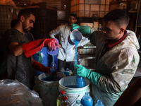 Palestinian manufacturers are bottling locally-made cleaning products in Deir el-Balah in the central Gaza Strip on July 8, 2024, amid a lac...