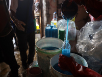 Palestinian manufacturers are bottling locally-made cleaning products in Deir el-Balah in the central Gaza Strip on July 8, 2024, amid a lac...