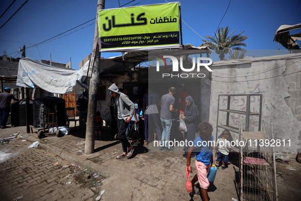 Palestinian manufacturers are bottling locally-made cleaning products in Deir el-Balah in the central Gaza Strip on July 8, 2024, amid a lac...