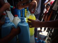 Palestinian manufacturers are bottling locally-made cleaning products in Deir el-Balah in the central Gaza Strip on July 8, 2024, amid a lac...