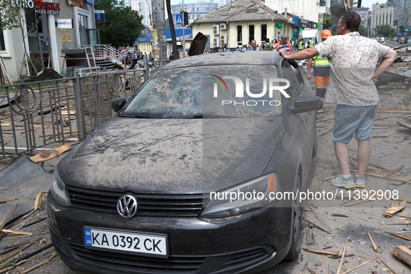 A man is leaning on a car parked near the Lukianivska metro station during a Russian missile attack in Kyiv, Ukraine, on July 8, 2024. NO US...