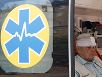 An elderly man with a bandaged head injured during a Russian missile attack is sitting in an ambulance in Kyiv, Ukraine, on July 8, 2024. NO...