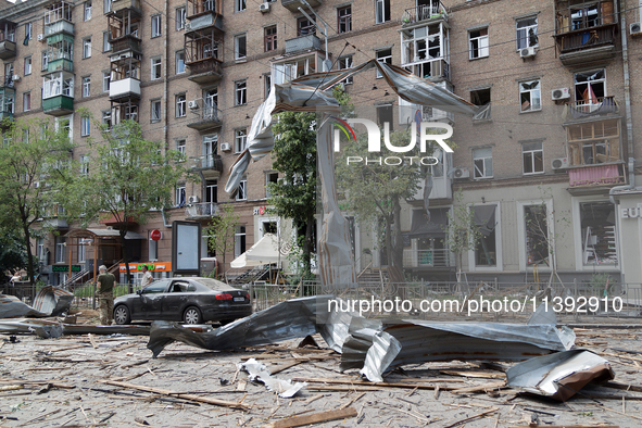 A piece of debris is hanging on the overhead line used by trolleybuses near the Lukianivska metro station during a Russian missile attack in...