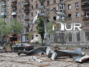 A piece of debris is hanging on the overhead line used by trolleybuses near the Lukianivska metro station during a Russian missile attack in...