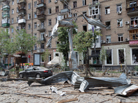 A piece of debris is hanging on the overhead line used by trolleybuses near the Lukianivska metro station during a Russian missile attack in...