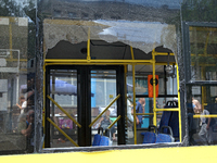 A smashed window is in a trolleybus near the Lukianivska metro station during a Russian missile attack in Kyiv, Ukraine, on July 8, 2024. (