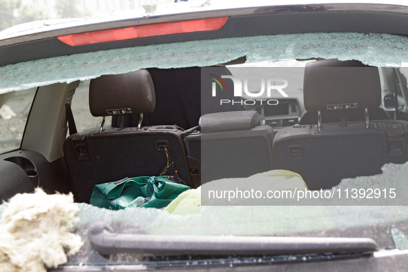 The interior of a car is being seen through the broken rear window of a car in the Shevchenkivskyi district during a Russian missile attack...