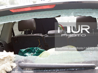 The interior of a car is being seen through the broken rear window of a car in the Shevchenkivskyi district during a Russian missile attack...