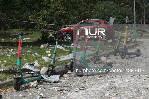 Debris is scattering around electric scooters in the Shevchenkivskyi district during a Russian missile attack in Kyiv, Ukraine, on July 8, 2...