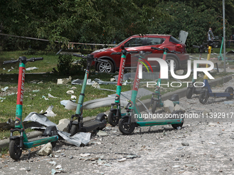 Debris is scattering around electric scooters in the Shevchenkivskyi district during a Russian missile attack in Kyiv, Ukraine, on July 8, 2...