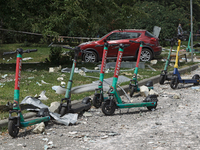 Debris is scattering around electric scooters in the Shevchenkivskyi district during a Russian missile attack in Kyiv, Ukraine, on July 8, 2...