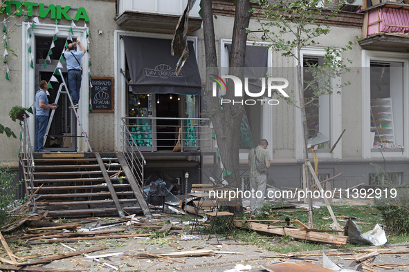 People are repairing a coffee shop near the Lukianivska metro station during a Russian missile attack in Kyiv, Ukraine, on July 8, 2024. NO...