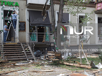 People are repairing a coffee shop near the Lukianivska metro station during a Russian missile attack in Kyiv, Ukraine, on July 8, 2024. NO...