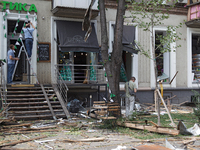 People are repairing a coffee shop near the Lukianivska metro station during a Russian missile attack in Kyiv, Ukraine, on July 8, 2024. NO...