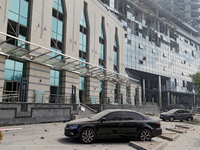 Cars are outside a building near the Lukianivska metro station damaged during a Russian missile attack in Kyiv, Ukraine, on July 8, 2024. NO...