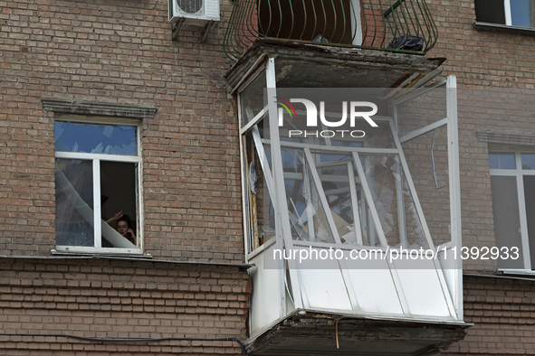 A knocked-out balcony is in a residential building near the Lukianivska metro station during a Russian missile attack in Kyiv, Ukraine, on J...