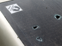 Holes are appearing in the rear window of a car with the sticker 'Baby on Board' in the Shevchenkivskyi district during a Russian missile at...