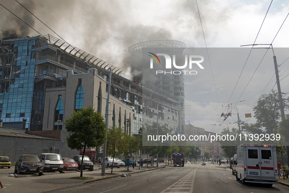 The roof of an unfinished building is catching fire near the Lukianivska metro station as a result of a Russian missile attack in Kyiv, Ukra...